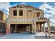 Unfinished two-story home with visible framing and a two-car garage, offering potential for customization at 5087 E Umber Rd, San Tan Valley, AZ 85143