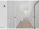 Hallway with two white doors and tile flooring at 5087 E Umber Rd, San Tan Valley, AZ 85143