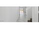 Bright hallway with tile flooring leading to a sliding glass door at 5087 E Umber Rd, San Tan Valley, AZ 85143