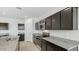 Black kitchen cabinets with granite countertops and stainless steel appliances at 5087 E Umber Rd, San Tan Valley, AZ 85143