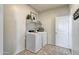 Laundry room with washer, dryer, and shelving at 5087 E Umber Rd, San Tan Valley, AZ 85143