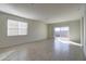 Bright and airy living room with sliding glass doors leading to the backyard at 5152 E Umber Rd, San Tan Valley, AZ 85143