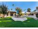 Landscaped backyard with patio furniture and grass at 5817 E Leith Ln, Scottsdale, AZ 85254