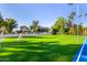 Large backyard with putting green, sports court, and soccer goals at 5817 E Leith Ln, Scottsdale, AZ 85254