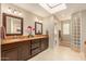 Double vanity bathroom with granite countertops and a glass shower at 5817 E Leith Ln, Scottsdale, AZ 85254