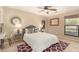 Bright bedroom with a comfortable bed, desk, and window at 5817 E Leith Ln, Scottsdale, AZ 85254