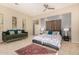 Main bedroom with a plush bed, daybed, and access to the patio at 5817 E Leith Ln, Scottsdale, AZ 85254