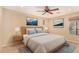 Bright bedroom with a comfortable bed and ceiling fan at 5817 E Leith Ln, Scottsdale, AZ 85254