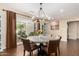 Charming dining room with round table and access to backyard at 5817 E Leith Ln, Scottsdale, AZ 85254