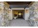 Elegant entryway with stone pillars and a wood door at 5817 E Leith Ln, Scottsdale, AZ 85254