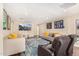 Gathering room with large screen TV, comfortable seating, and area rug at 5817 E Leith Ln, Scottsdale, AZ 85254