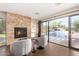 Gathering room with fireplace and sliding doors to the pool area at 5817 E Leith Ln, Scottsdale, AZ 85254