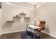 Bright home office features a desk, chair, and floating shelves at 5817 E Leith Ln, Scottsdale, AZ 85254