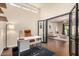 Home office with built-in shelves and view into living area at 5817 E Leith Ln, Scottsdale, AZ 85254