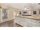 Kitchen with island and white cabinets at 5817 E Leith Ln, Scottsdale, AZ 85254