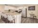 Kitchenette with granite countertop and bar seating at 5817 E Leith Ln, Scottsdale, AZ 85254