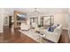 Modern living room with a stone fireplace and large TV at 5817 E Leith Ln, Scottsdale, AZ 85254