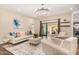 Bright living room featuring a comfy seating area and sliding glass doors to patio at 5817 E Leith Ln, Scottsdale, AZ 85254