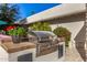 Stainless steel grill built into an outdoor kitchen with stone countertops at 5817 E Leith Ln, Scottsdale, AZ 85254