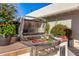 Burgers and peppers grilling on a stainless steel outdoor grill at 5817 E Leith Ln, Scottsdale, AZ 85254