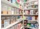 Well-organized pantry with ample shelving for food storage at 5817 E Leith Ln, Scottsdale, AZ 85254