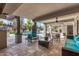 Covered patio with seating area overlooking the pool at 5817 E Leith Ln, Scottsdale, AZ 85254
