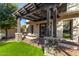 Relaxing patio with pergola and stone pillars at 5817 E Leith Ln, Scottsdale, AZ 85254