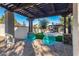 Relaxing pergola with teal chairs, overlooking the backyard at 5817 E Leith Ln, Scottsdale, AZ 85254