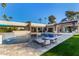 Large pool with lounge chairs and a waterfall feature at 5817 E Leith Ln, Scottsdale, AZ 85254