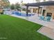 Luxury pool with artificial turf and pergola at 5817 E Leith Ln, Scottsdale, AZ 85254