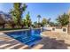 Luxury pool with waterfall and ample lounge space at 5817 E Leith Ln, Scottsdale, AZ 85254