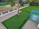 Aerial view of putting green and sports court at 5817 E Leith Ln, Scottsdale, AZ 85254