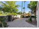 Landscaped side yard with brick pavers and mature trees at 5817 E Leith Ln, Scottsdale, AZ 85254