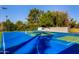 Blue sports court with basketball and pickleball at 5817 E Leith Ln, Scottsdale, AZ 85254