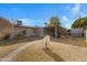 Landscaped backyard with a patio and walkway at 616 W Toledo St, Chandler, AZ 85225