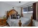 Comfortable bedroom with a wooden bed frame and calming decor at 616 W Toledo St, Chandler, AZ 85225