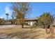 Ranch-style home with a carport and mature trees at 616 W Toledo St, Chandler, AZ 85225