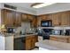 Modern kitchen with dark wood cabinets and tile backsplash at 616 W Toledo St, Chandler, AZ 85225