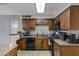 Bright kitchen with dark wood cabinets and modern appliances at 616 W Toledo St, Chandler, AZ 85225