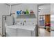 Functional laundry room with washer, dryer, and storage at 616 W Toledo St, Chandler, AZ 85225