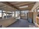 Enclosed porch with table, chairs, and a view of the backyard at 616 W Toledo St, Chandler, AZ 85225