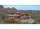 Desert mountain home with solar panels and a large driveway at 6520 E El Sendero Rd, Carefree, AZ 85377