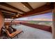 Relaxing deck with sunset views, comfortable seating, and telescope at 6520 E El Sendero Rd, Carefree, AZ 85377