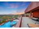 Large deck overlooking the pool and city views at 6520 E El Sendero Rd, Carefree, AZ 85377