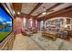 Cozy Gathering room with hardwood floors and a large TV at 6520 E El Sendero Rd, Carefree, AZ 85377