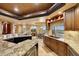 Large kitchen with granite counters and stainless steel appliances at 6520 E El Sendero Rd, Carefree, AZ 85377