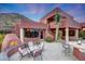 Outdoor patio with seating area and fire pit at 6520 E El Sendero Rd, Carefree, AZ 85377