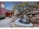 Serene waterfall feature with rock landscaping at 6520 E El Sendero Rd, Carefree, AZ 85377