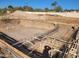 Empty pool with rebar and plumbing visible at 6726 E Shea Blvd, Scottsdale, AZ 85254