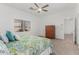 Bright bedroom with carpeted floor, ceiling fan, and large window at 7664 W Karen Lee Ln, Peoria, AZ 85382